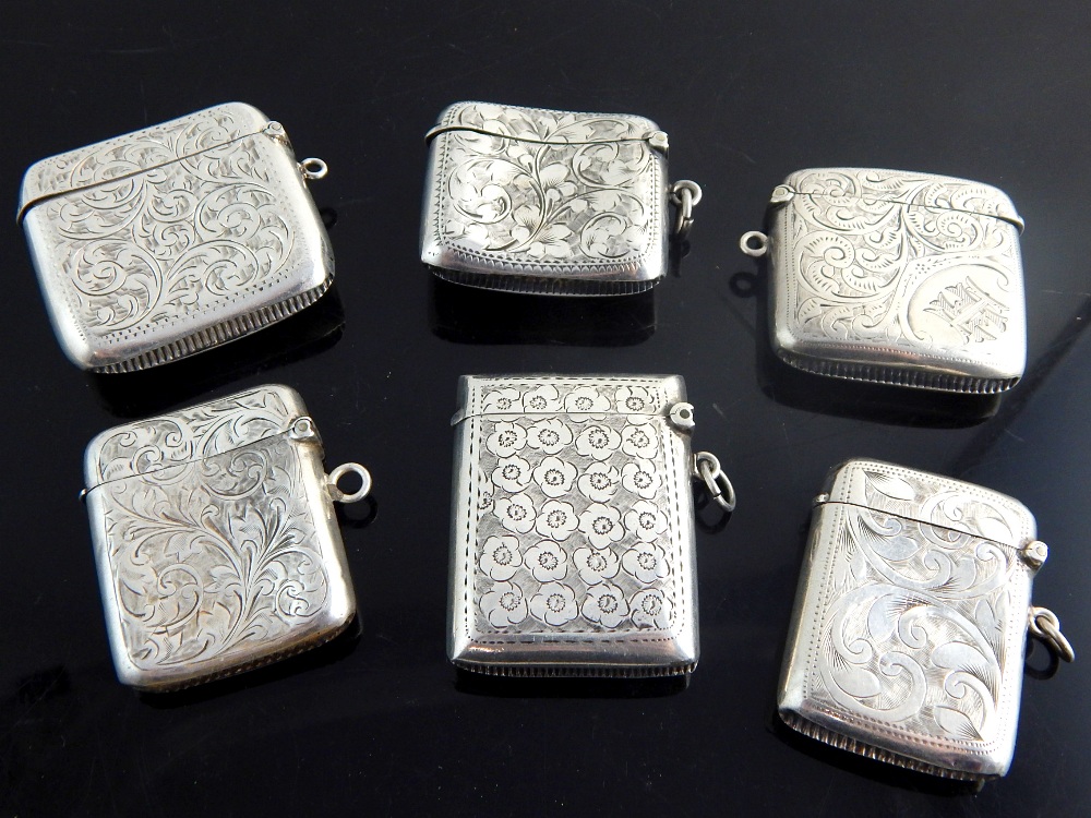 Six silver Vesta cases, all with foliate decoration and monograms, - Image 2 of 2