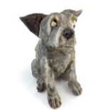 Plaster maquette of a seated pug type dog with a guilty look, finished with a painted wash,