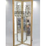 Pair of 19th C French girandole, cream and gilt frames with sectional mirrors,