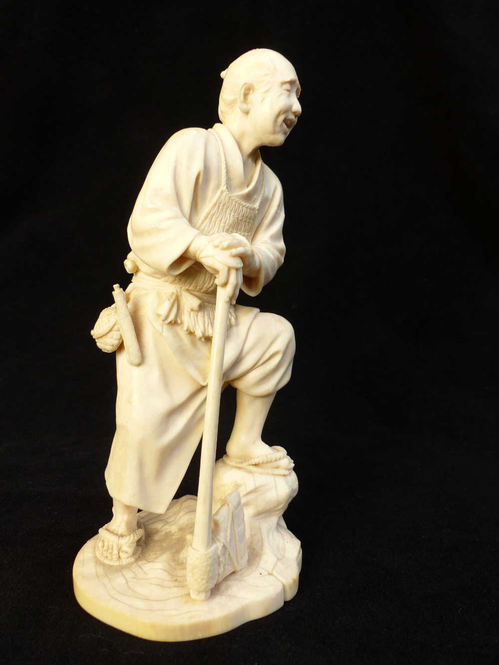 Fine 19th C Japanese carved ivory okimono of a woodsman leaning on his axe, signed to base, 20. - Image 3 of 4