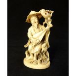 Rare antique carved ivory group of a wandering Chinese minstrel strumming a lute,