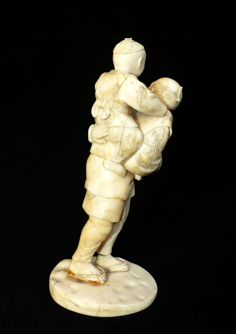 Late 19th C Japanese carved ivory group of a fisherman carrying his son who is holding a crab, - Image 2 of 5