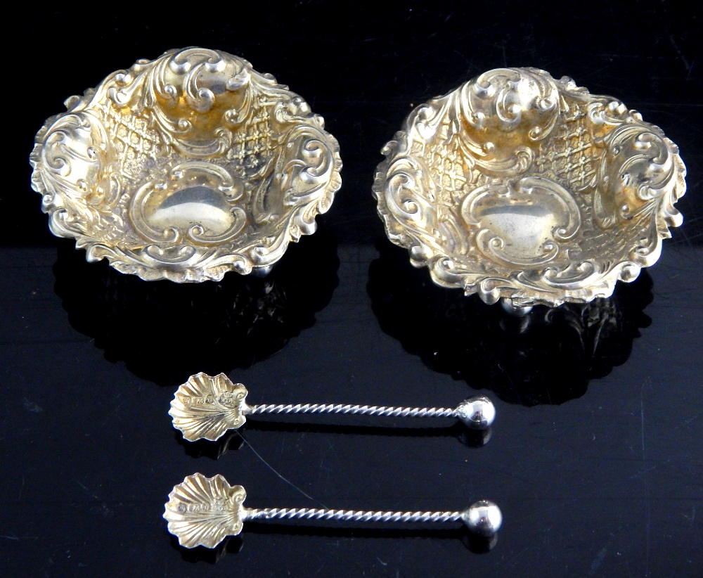 Pair of hallmarked silver gilt Rococo repousse decorated salts together with spoons,