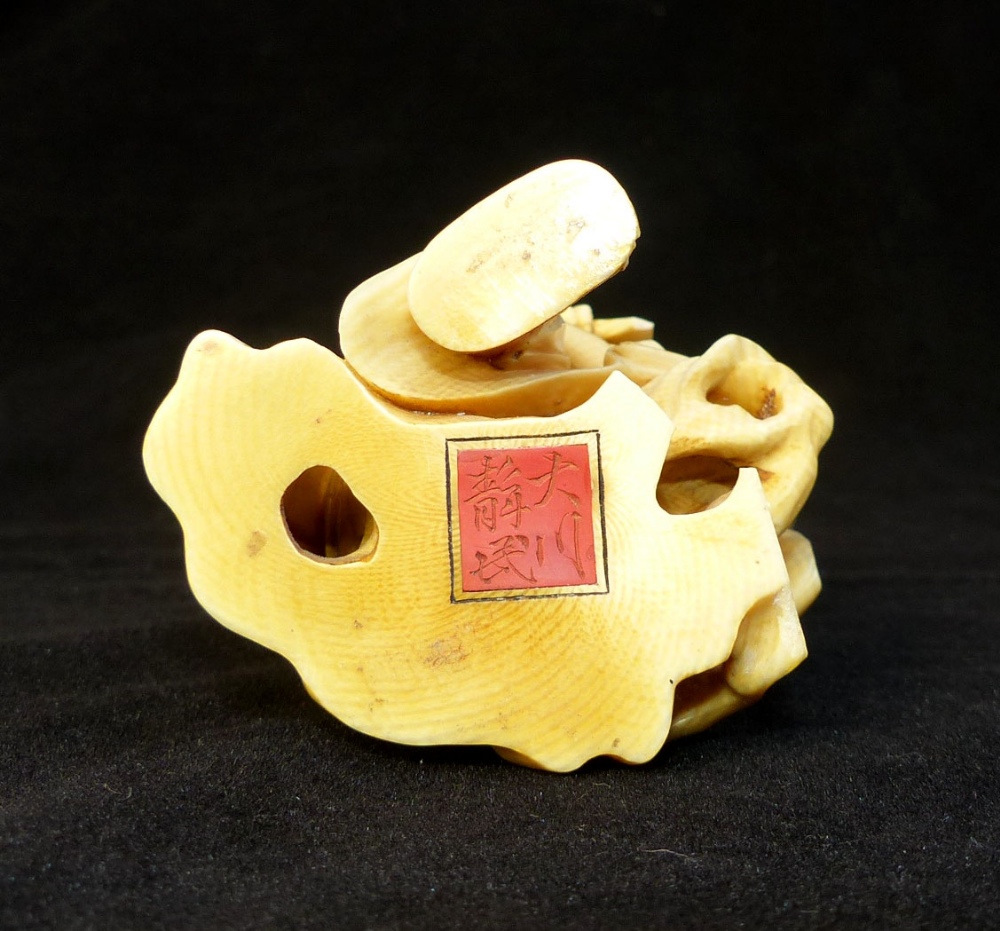 A19th C carved ivory okimono of a plump monk strumming a lute, signed in red seal to base, - Image 4 of 4