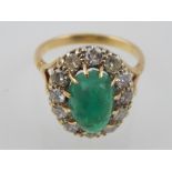 Cabouchon emerald and diamond cluster ring on 18ct gold shank