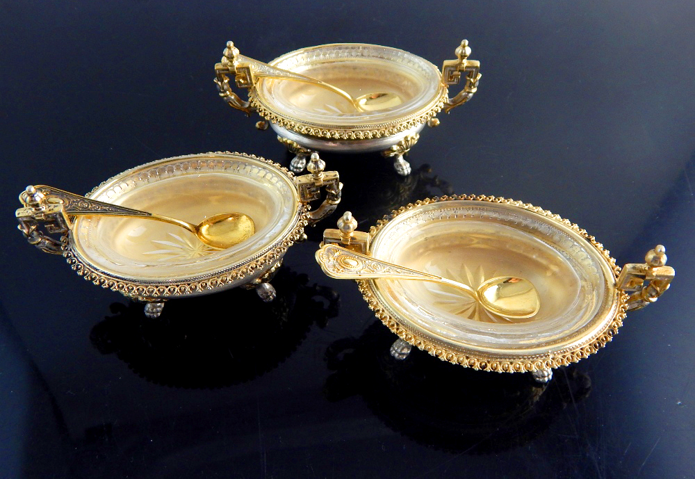 Trio of silver gilt salt dishes of Rococo design,