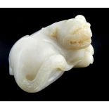 Chinese carved mutton fat jade figure, a recumbent dog of Fo, 6.