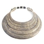 Unusual ringtore white metal necklace with incised and engraved designs, ethnic Miao tribe,