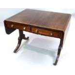 Regency brass inlaid rosewood sofa table with rectangular twin flap top over two drawers on solid