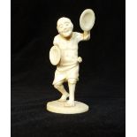 Carved antique ivory figure of a venerable cymbal player,