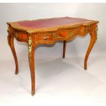 Louis XVI style French serpentine kingwood and brass mounted writing table,