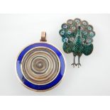 Sterling silver and enamelled peacock brooch,