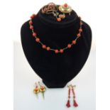 Selection of red coral jewellery items in yellow metal and gold mounts,