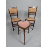 Pair of Edwardian mahogany occasional chairs, the inlaid top rail above a pad back and seat,