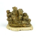 Late Qing dynasty soapstone carving, study of Emperor with fan flanked by two men offering gifts,
