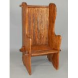 Elm lambing or porters chair, with panelled back and shaped solid sides of wedged construction,