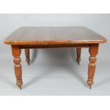 Late Victorian walnut extending dining table, with a leaf insertion,