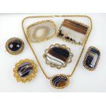 Good selection of various gold and yellow mounted banded agate brooches and a pendant,