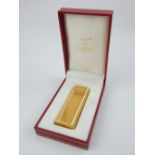 Must de Cartier gold plated lighter of vertical ribbed decoration,