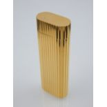 Must de Cartier gold plated lighter of vertical ribbed decoration