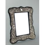 Contemporary Victorian style silver easel dressing table mirror embossed with trailing flowers,