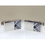 Pair of Burberry cufflinks, the polished rectangular buttons with chequer enamel panel,