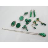 Selection of various silver mounted malachite brooches and pendants etc.