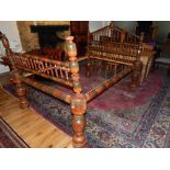 Indian turned hardwood 4 foot bed frame, striped decoration of red,