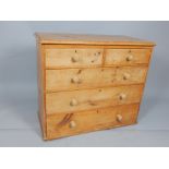 Victorian pine chest of drawers, the rectangular top above two short and three long drawers,