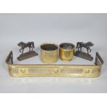 Pair of Victorian cast iron horse door stops, a pierced brass fender and two brass jardineres.