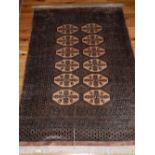 Pakistani rug, the centre with two rows of octagonal medallions within reticulated borders,