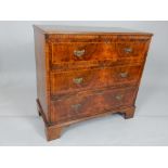 George II style walnut chest of drawers, the rectangular top above an arrangement of three drawers,