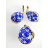 Three yellow metal blue enamelled and white stone mounted egg pendants,