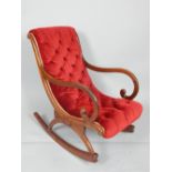 A Victorian style mahogany framed rocking chair,