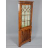 Reproduction yew standing corner corner cabinet, with glazed upper section on bracket feet,