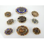 Mourning brooches, gold and yellow metal, some enamelled,