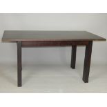 Contemporary ebonised ash table, the rectangular extending top above rectangular slab legs,
