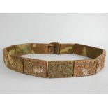 Chinese soapstone belt, the rectangular segments carved with scrolling foliage,