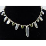 Silver peridot and moonstone necklace with elliptical and oval faceted stones