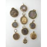 Good selection of gold and yellow metal mourning lockets and pendants,