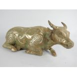 Chinese verdigris bronze ox with white metal inlay,
