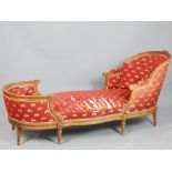 Louis XVI style chaise longue, the walnut frame with a ribbon tie and scroll carving,