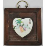 An erotic ceramic Chinese wall hanging plaque