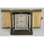 An Art Deco travelling clock in original case,