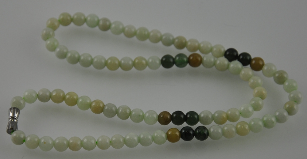 A light and dark jade bead necklace