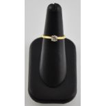 An 18 carat yellow gold solitaire diamond ring the claw set stone 0.