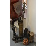 A collection of Victorian and later metalware to include shell cases, door stops,