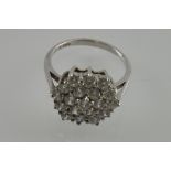 A silver dress ring set with a hexagonal cubic zirconia cluster