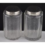 A pair of Victorian silver mounted faceted glass bottles with star bases,