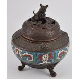 An early 20th Century Japanese bronze and champleve koro with pierced cover and dog of Fo finial on